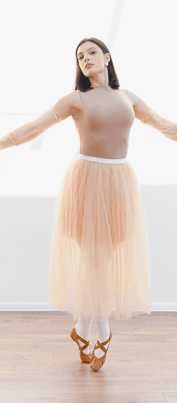 Dancer wearing a flowing peach skirt